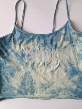 spaghetti top on grey background, tie dye blue, white embroidery lettering spelling 